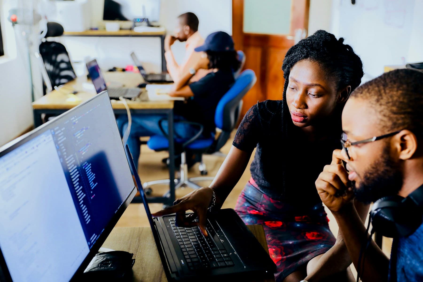 Developers reviewing code together at a workstation