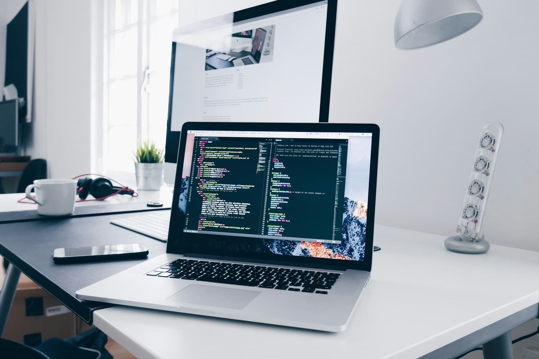 A developer building a digital product at a workstation